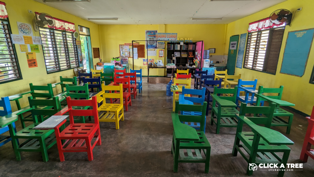 Classroom in the Philippines with colorful school chairs made from collected and recycled plastic.